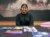 A photo of Swati Ravi with her quilt on the table.